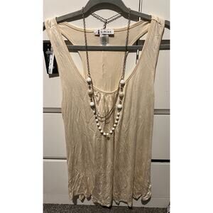 cream-colored tank top racerback
 and scoop neckline the brand Libian size 3xl